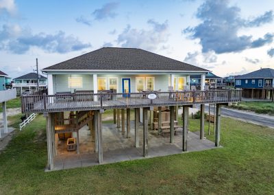841 Buell Street, Crystal Beach, Texas, 77650, Owner Edward White, Photographed at daybreak, located on the Gulf of America. The house has 3 bedrooms, 2 full baths, laundry room, kitchen, living room dining room, deck, parking area underneath, downstairs shower and view of the beach and Gulf.