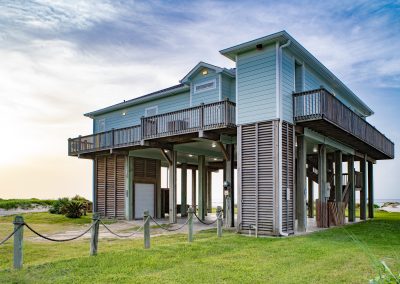 841 Buell Street, Crystal Beach, Texas, 77650, Owner Edward White, Photographed in the morning. Located on the Gulf of America. The house has 3 bedrooms, 2 full baths, laundry room, kitchen, living room dining room, deck, parking area underneath, downstairs shower and view of the beach and Gulf.