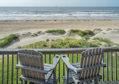 841 Buell Street, Crystal Beach, Texas, 77650, Owner Edward White, View of the sand dunes and Gulf from the second floor deck in early morning light. The house has 3 bedrooms, 2 full baths, laundry room, kitchen, living room dining room, deck, parking area underneath, downstairs shower and view of the beach and Gulf.